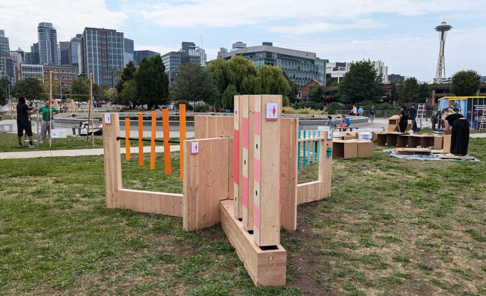 photo of the timbre installation at seattle design festival black party with space needle in the background