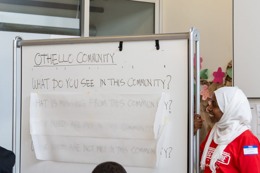 photo of project pipeline mentor at a white board with deign prompts written on it