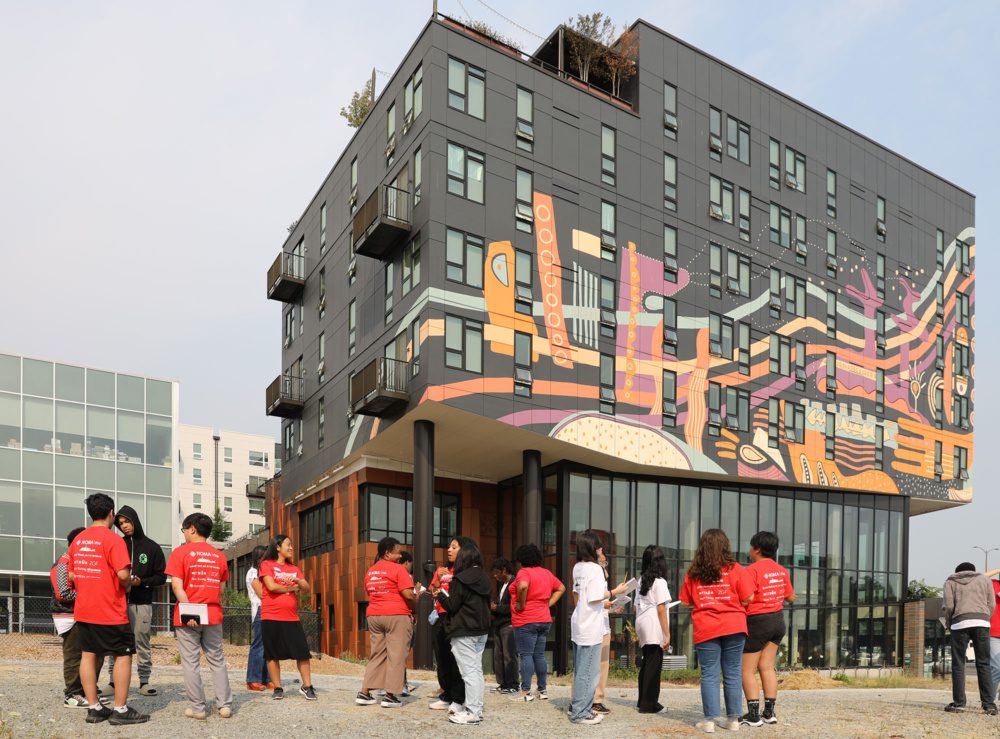 photo of project pipeline students and mentors looking at the vacant space in othello square next to orenda